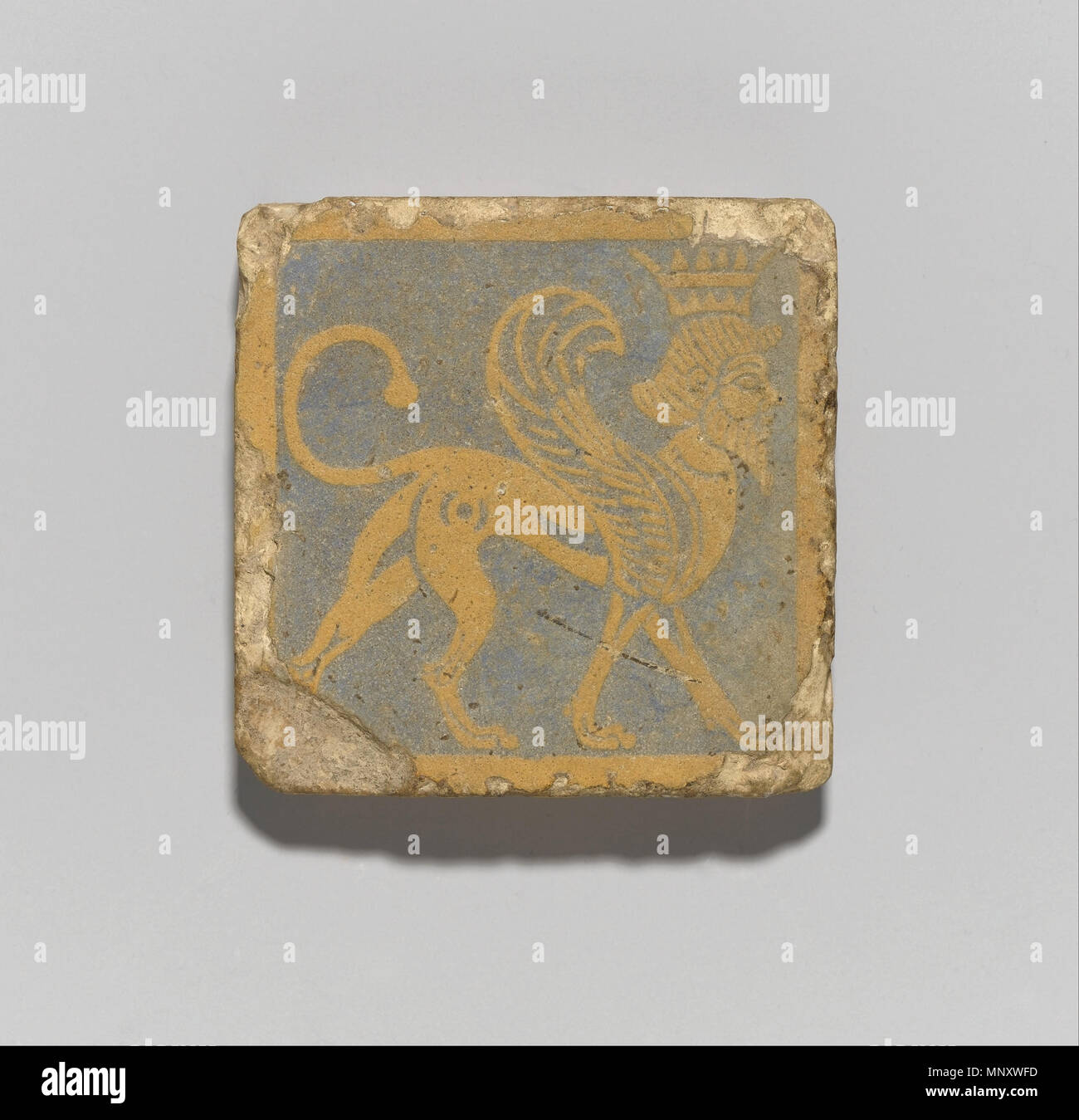 Tile with Winged, Crowned Sphinx   3rd century B.C.E..   1193 Tile with Winged, Crowned Sphinx - Google Art Project Stock Photo