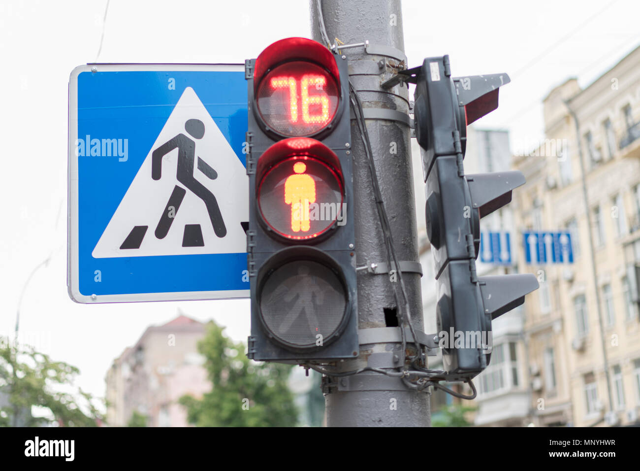 The traffic light for pedestrians shows a red color Stock Photo - Alamy