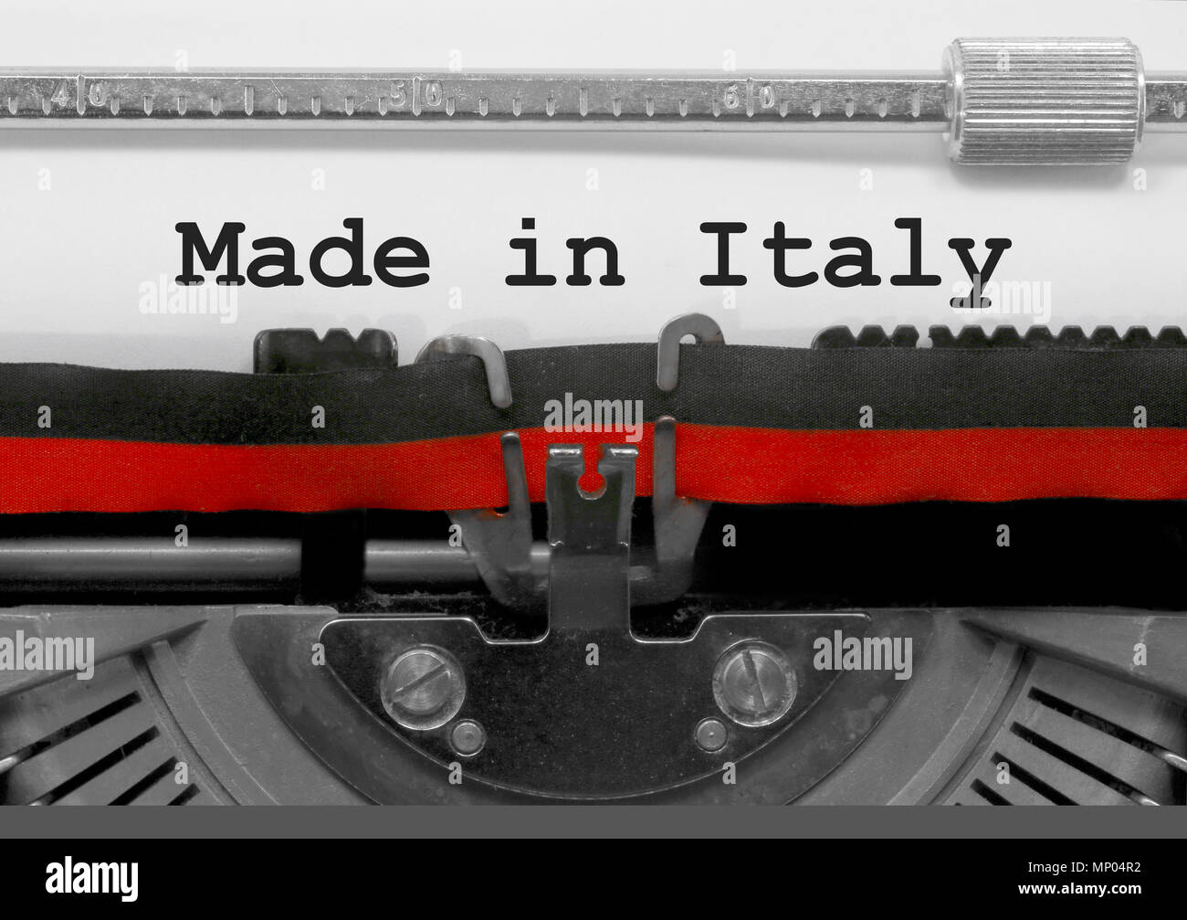 Made in Italy text written by an old typewriter on white sheet Stock Photo