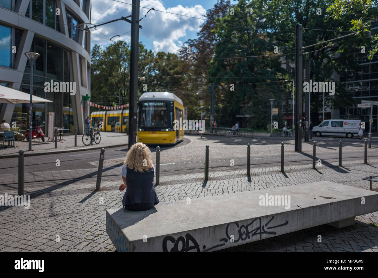 Berlin, Germany, Hackescher Markt, area. Blonde, women, sitting, waiting for the Tram, 14:03:22 Monday, 28.08.17, © Peter SPURRIER, Stock Photo