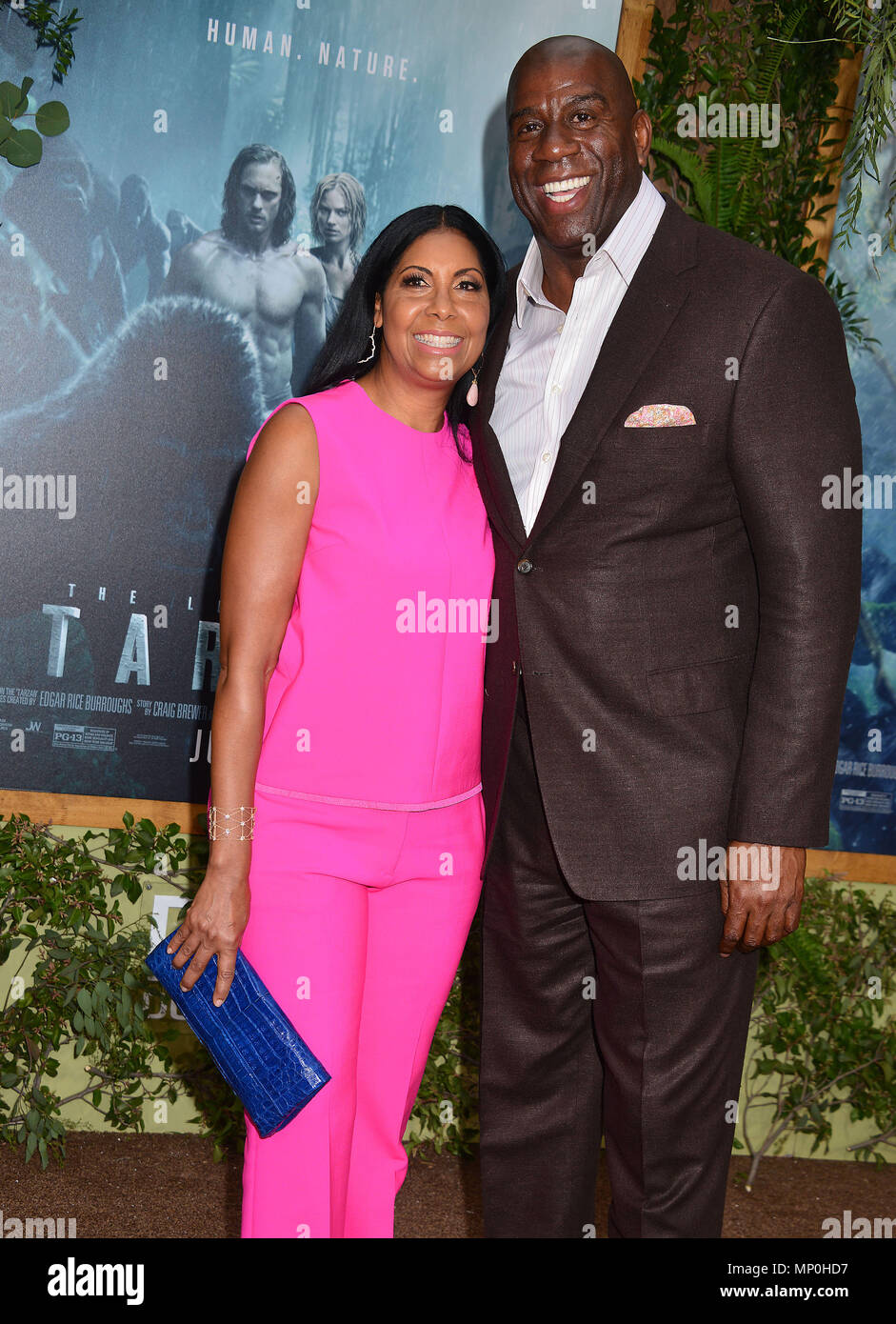 Magic Johnson, wife Cookie 080 at the Legend of Tarzan Premiere at the