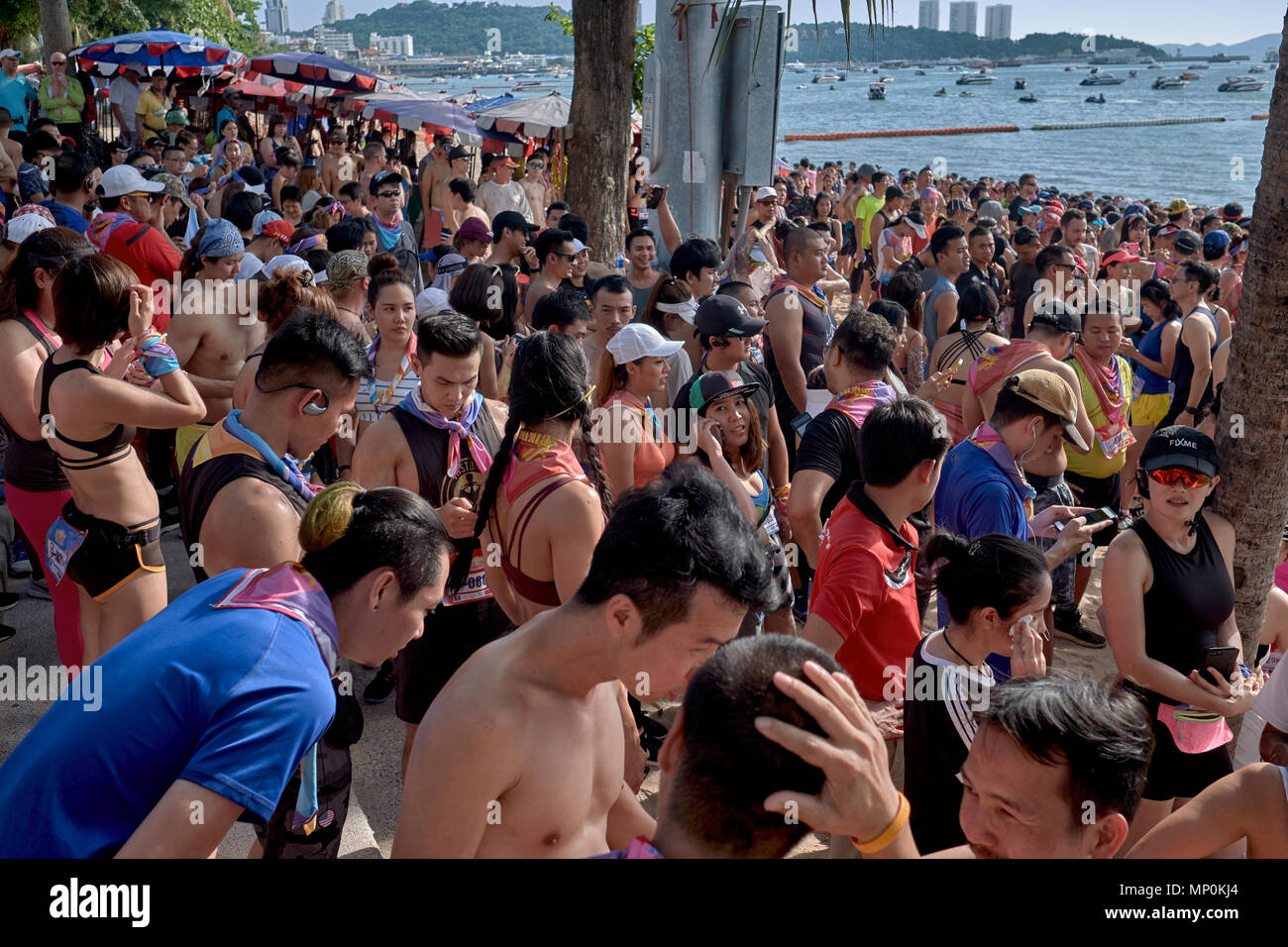 Large crowd lining the beach awaiting the start of a fun run, Pattaya, Thailand, 2018 Stock Photo