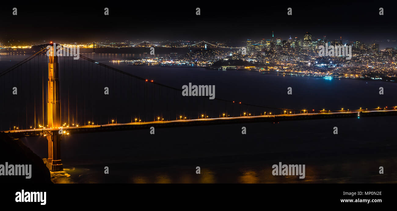 San Francisco nightscape with the Golden Gate Bridge from Hawk Hill in the Golden Gate National Recreation Area Stock Photo