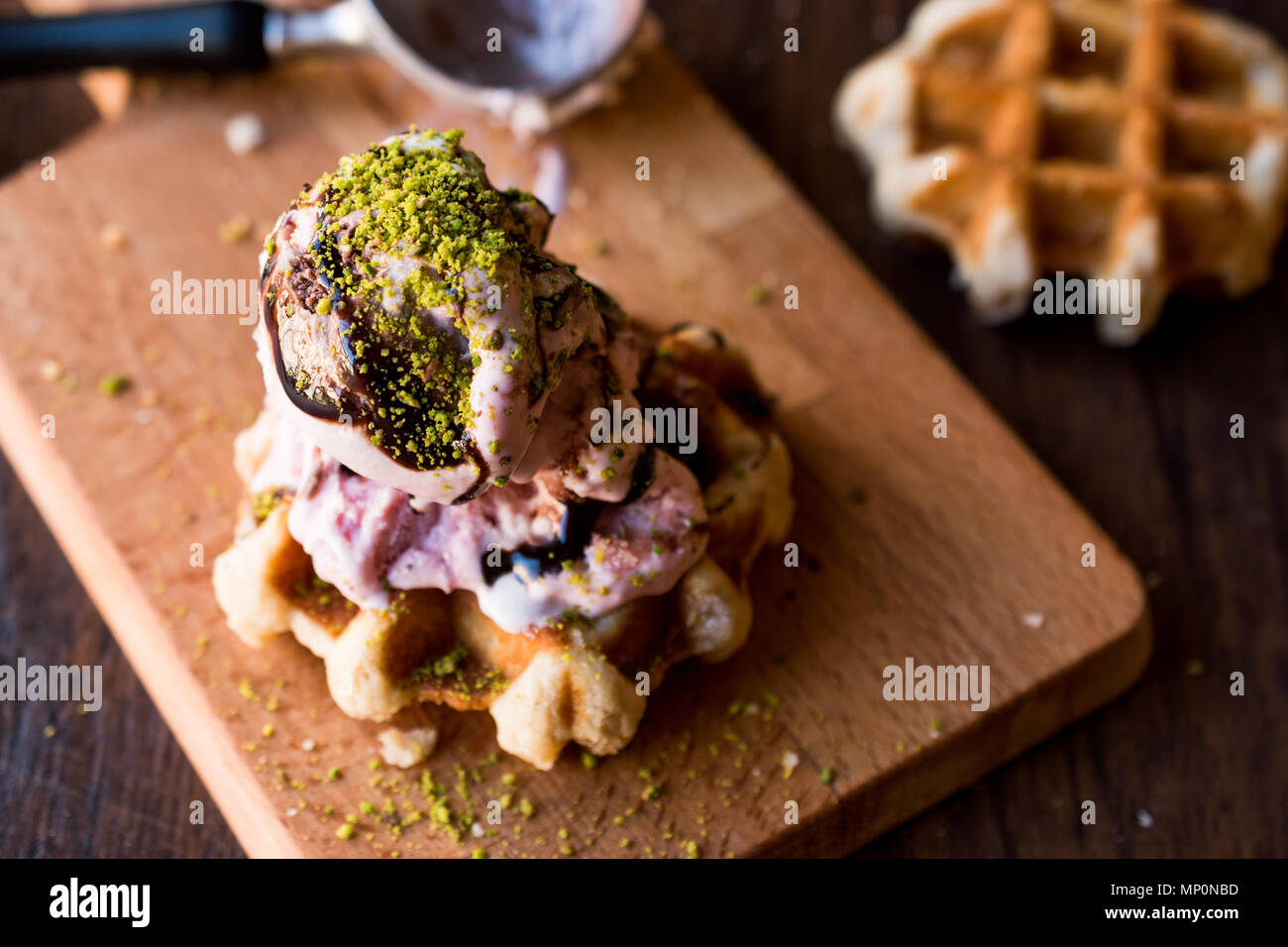 Belgium Waffle with ice cream on wooden surface. Traditional Food Stock ...