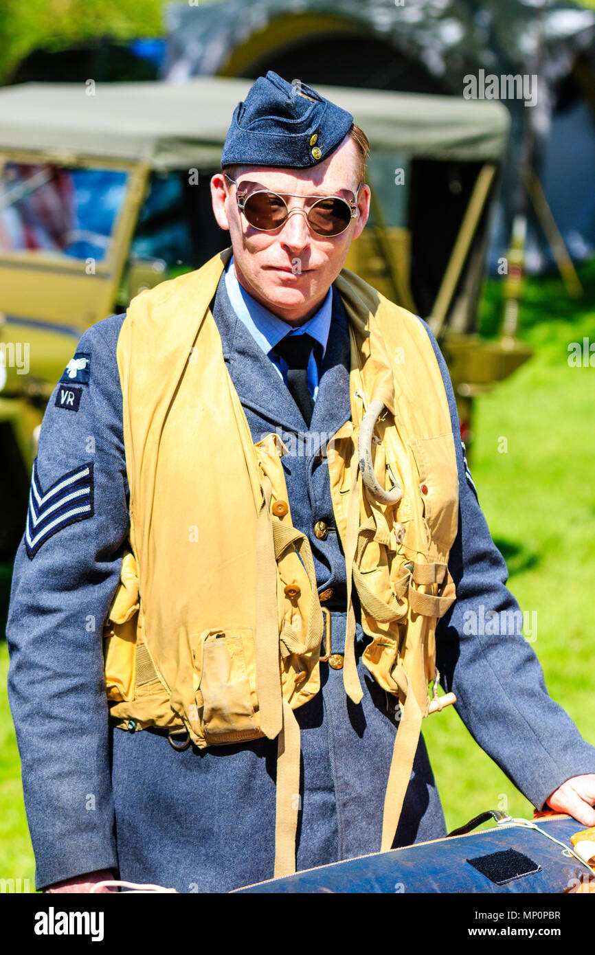 Popular Salute to the 40s event at Sandwich town, Kent. World war two young man re-enactor, RAF pilot with life jacket on. Close up. Facing. Stock Photo