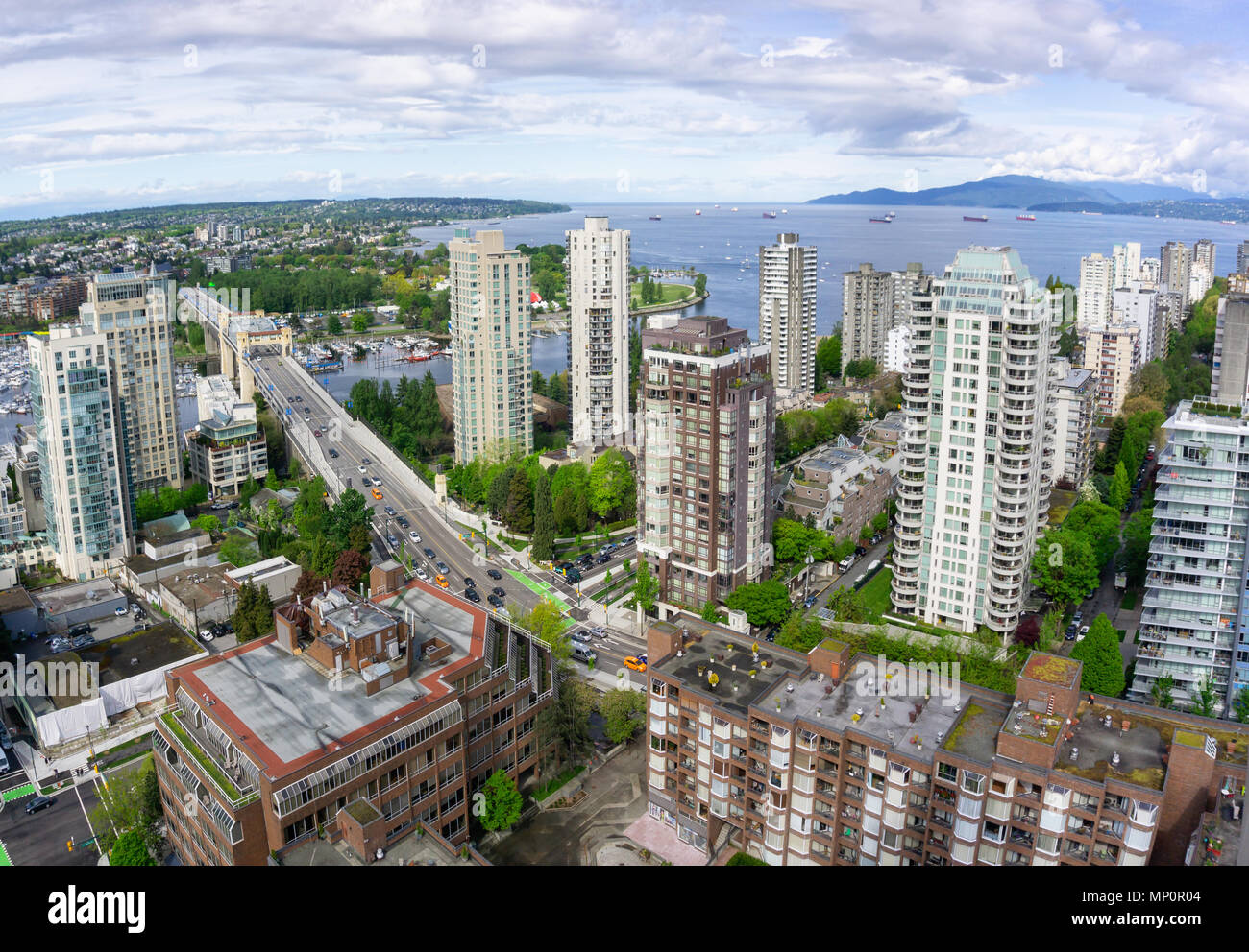 Aerial panoramic view of a beautiful modern cityscape during a cloudy ...