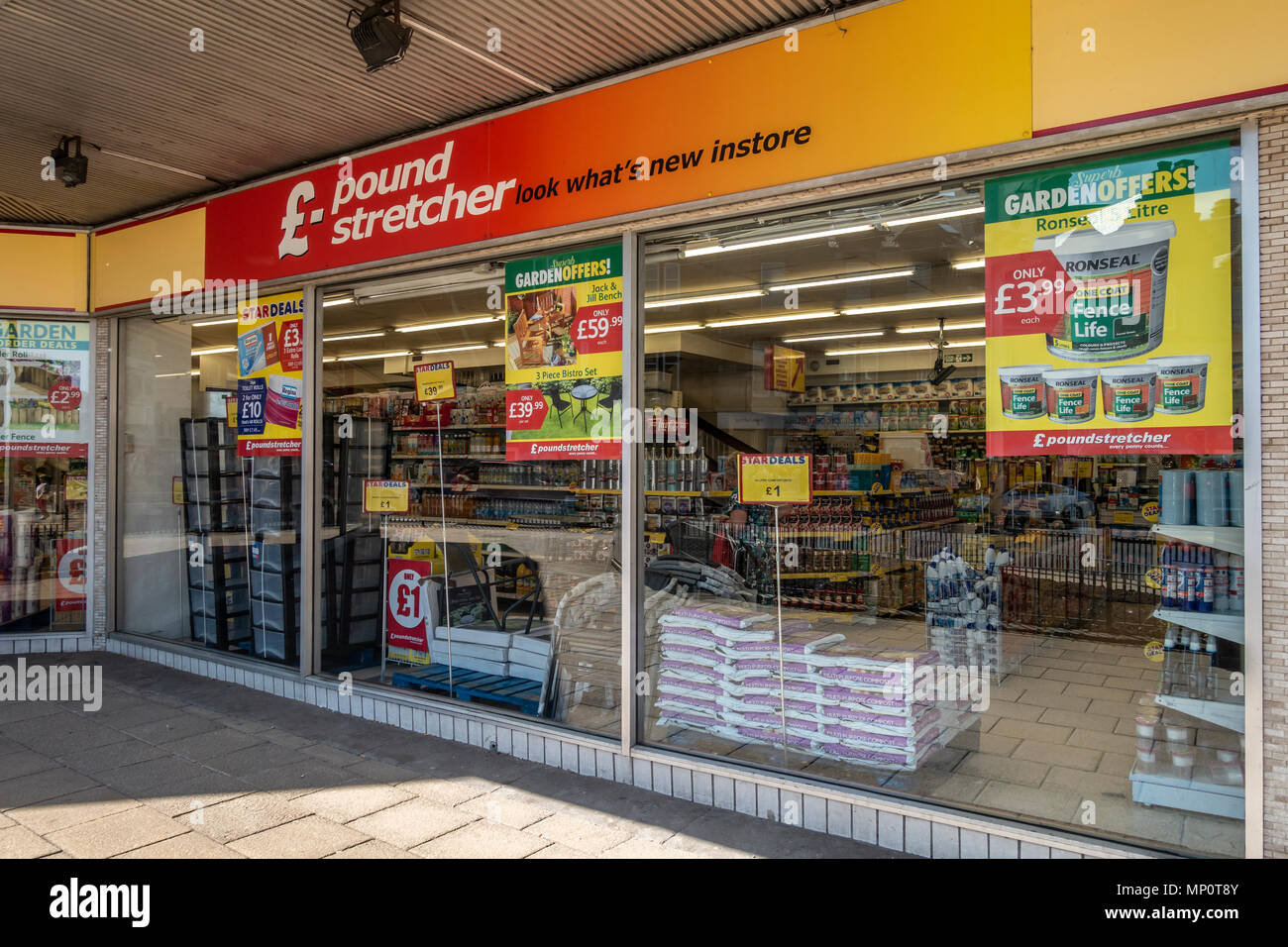 Exterior of a Poundstretcher discount shop in Hamilton, South Lanarkshire, Scotland, UK. Posters, display units and goods for sale. Stock Photo