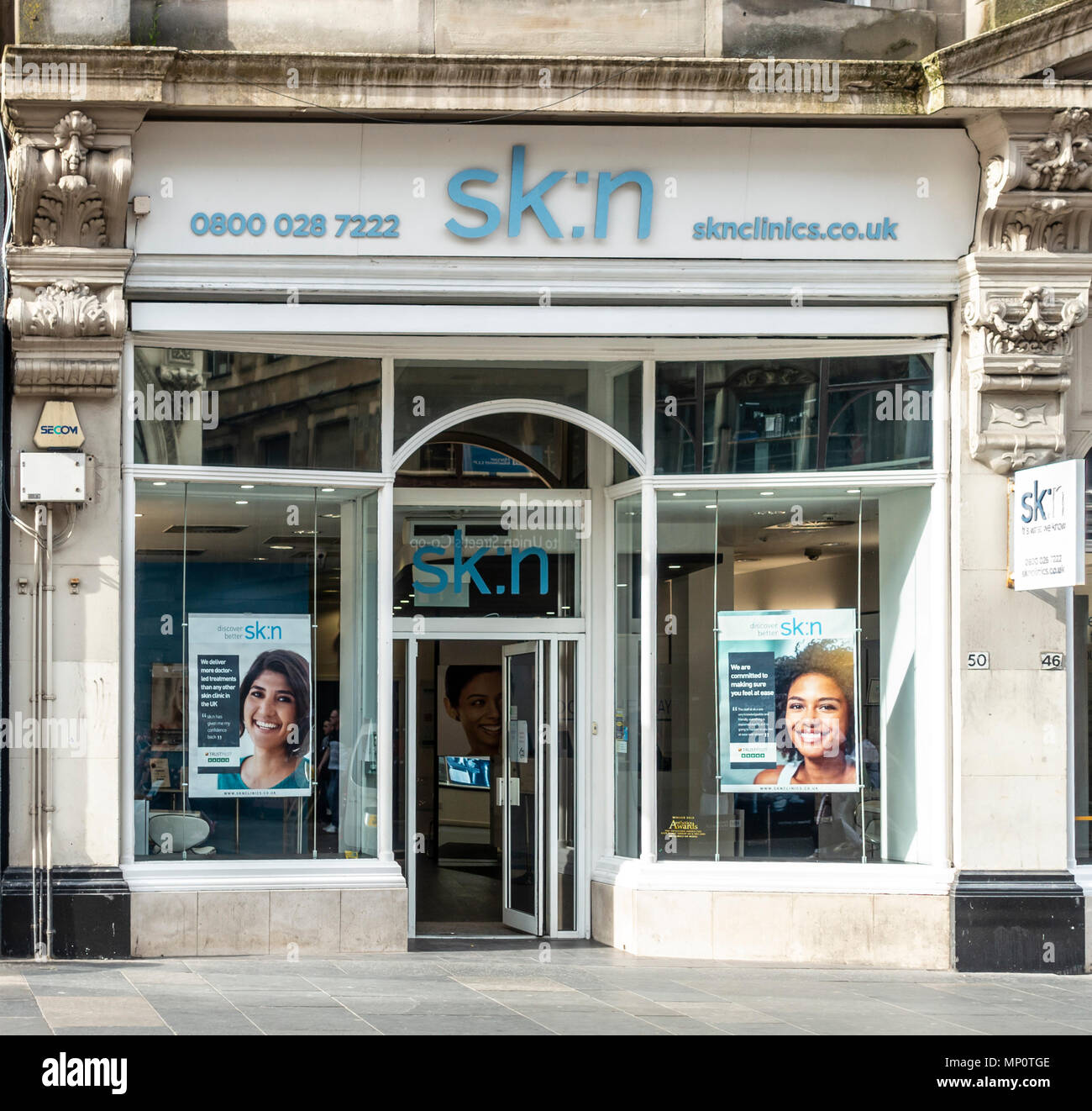 Shop frontage and entrance to the Sk:n clinic in central Glasgow, Scotland, UK Stock Photo