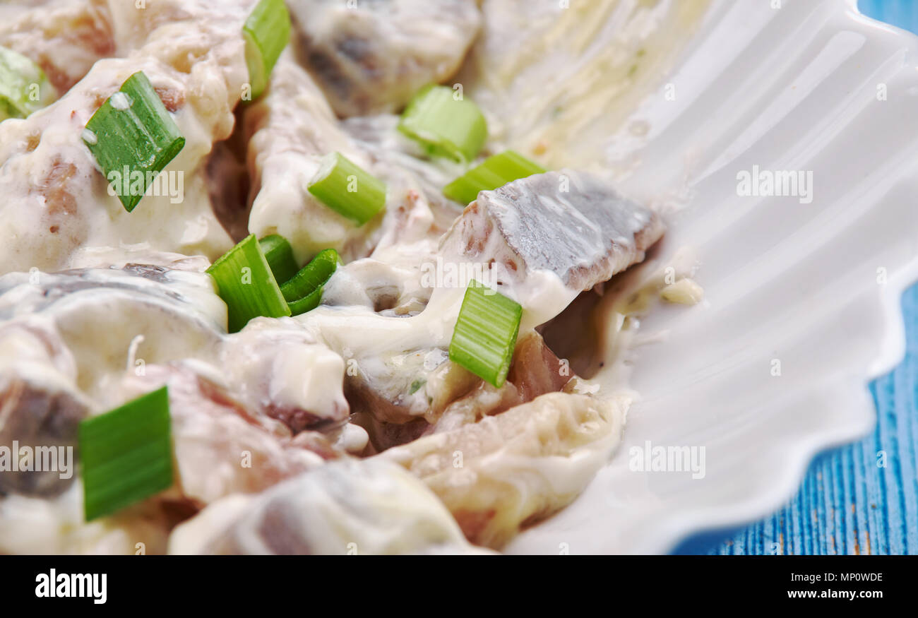Polish Herring in Sour Cream Sledzie smietanie, close up Stock Photo