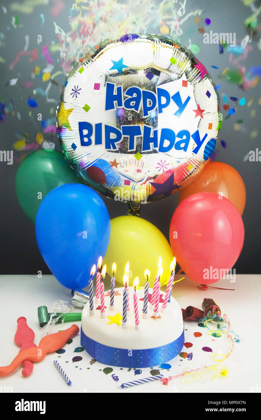 Party concept showing a Birthday cake,candles,balloons,party