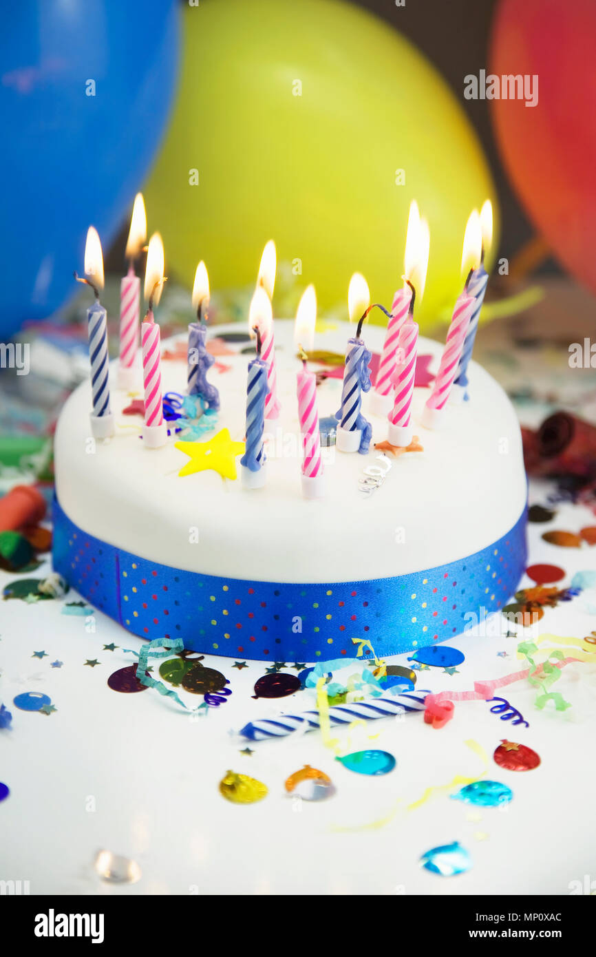 Birthday cake with lighted candles Stock Photo Alamy