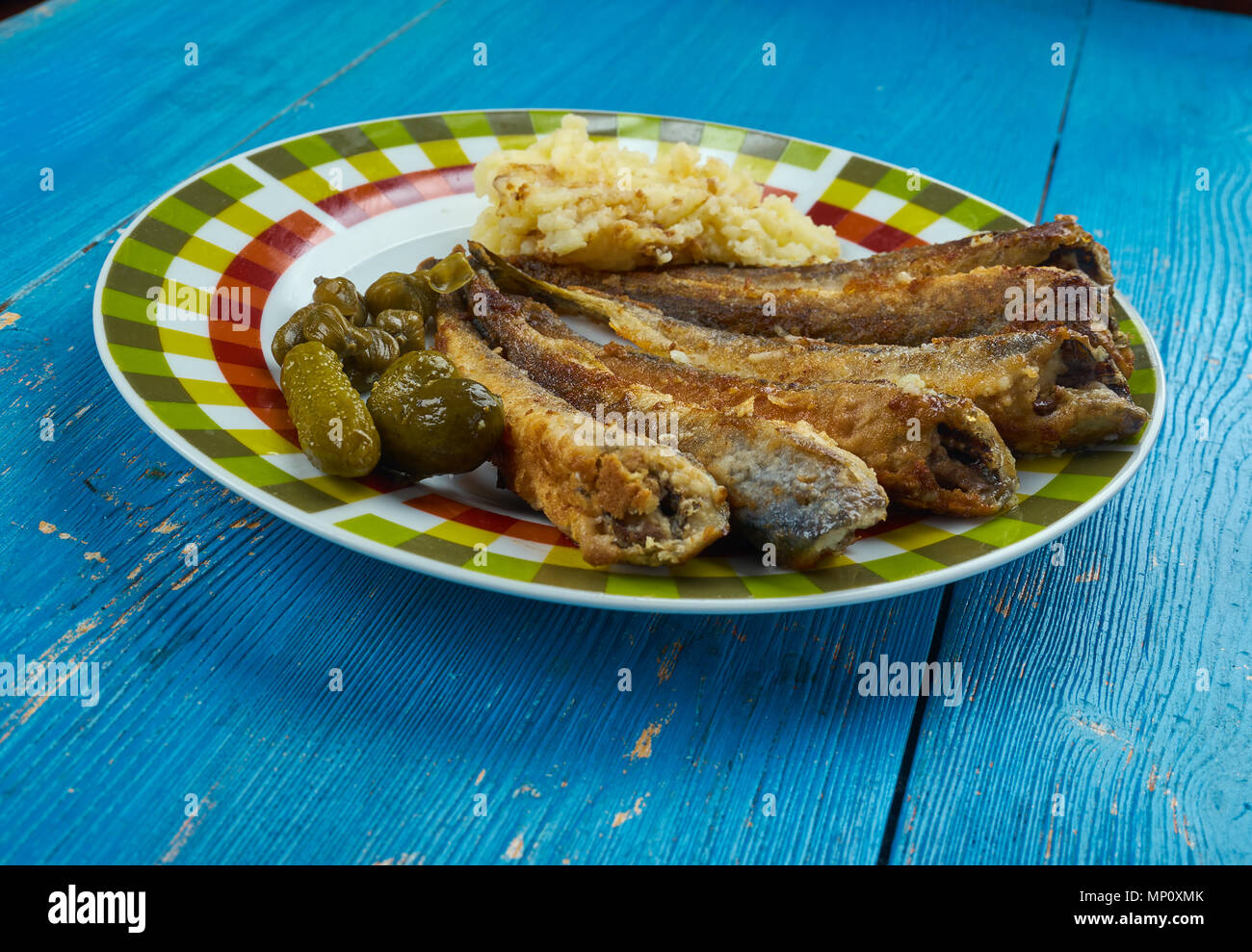 Fried navaga , Fried fish with vegetable garnish Stock Photo - Alamy