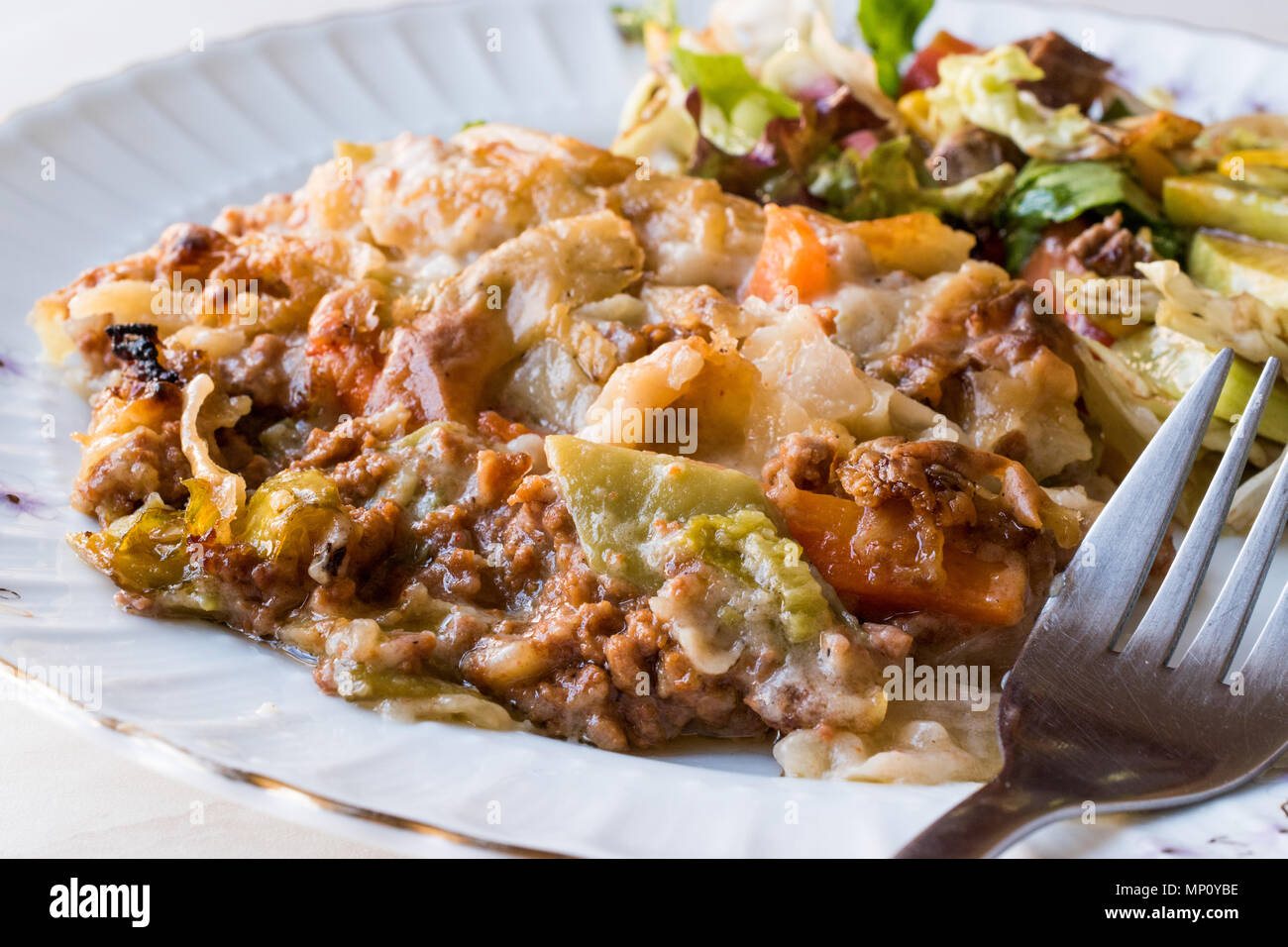 Vetegables Gratin with Minced Meat, Cheese and served with Salad. Traditional Food Stock Photo