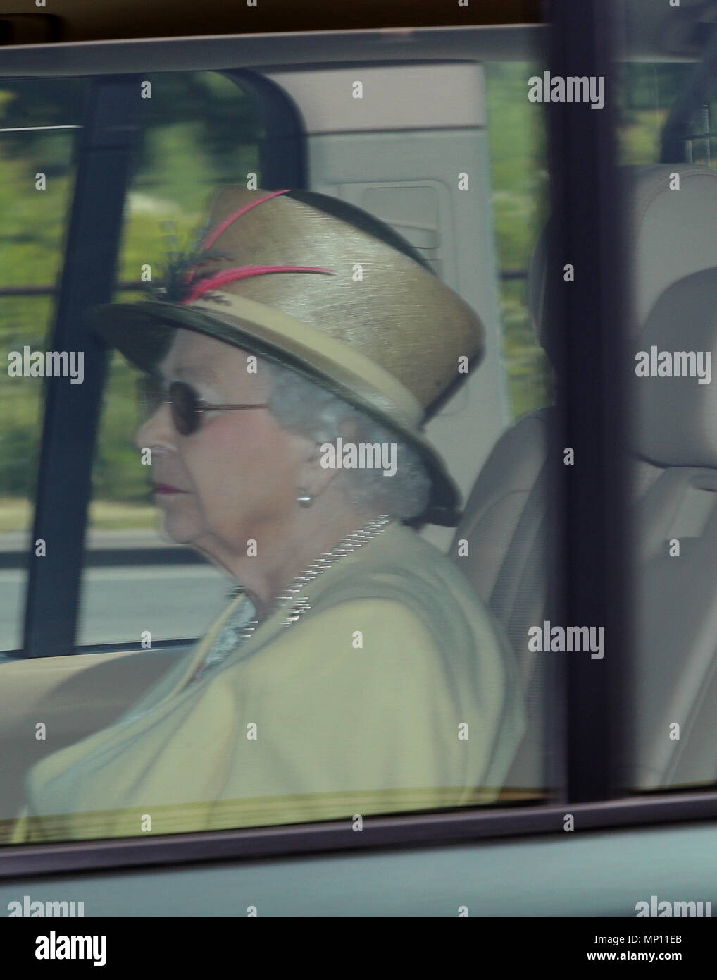 Queen Elizabeth II is driven into Windsor Castle in a Range Rover the day after the royal