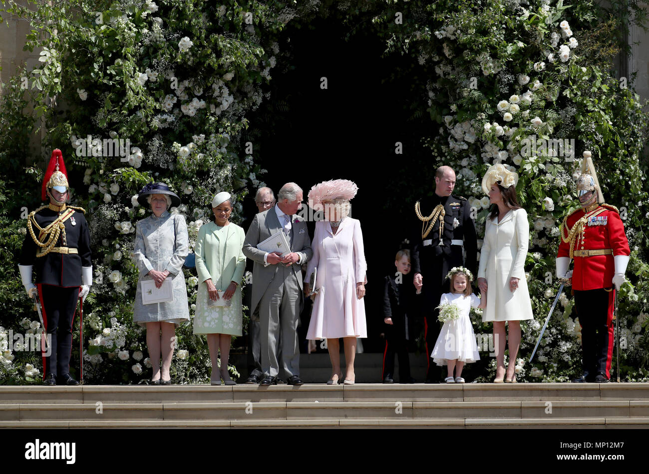 Doria Ragland, the Prince of Wales, the Duchess of Cornwall, the Duke and Duchess of Cambridge with Prince George and Princess Charlotte leave St George's Chapel in Windsor Castle after the wedding of Prince Harry and Meghan Markle. Stock Photo