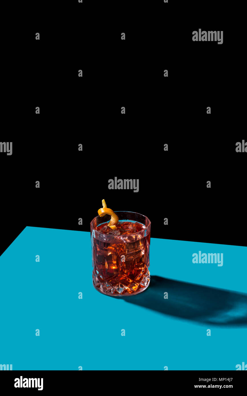 Negroni IBA cocktail, with gin, bitter, vermut, in pop contemporary style, colorful, dark