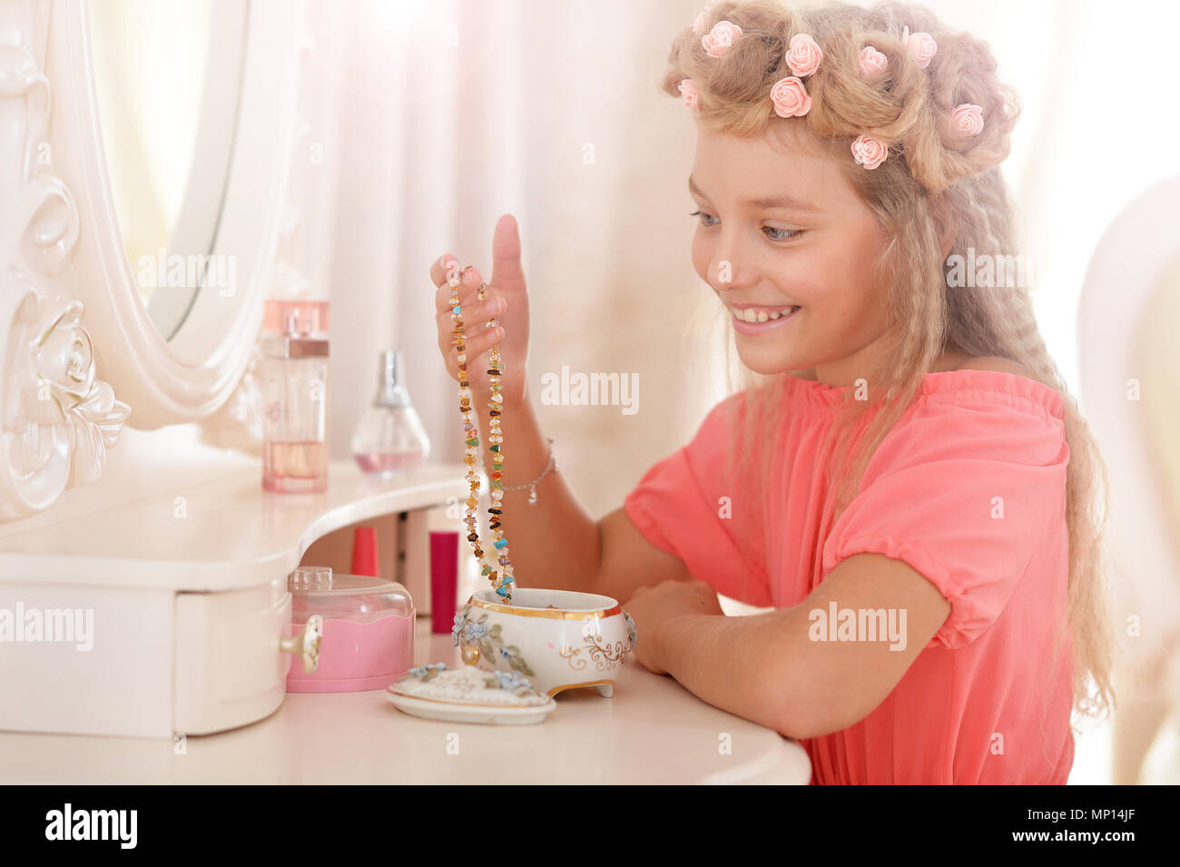 adorable girl in beautiful pink dress with stylish hairstyle Stock ...