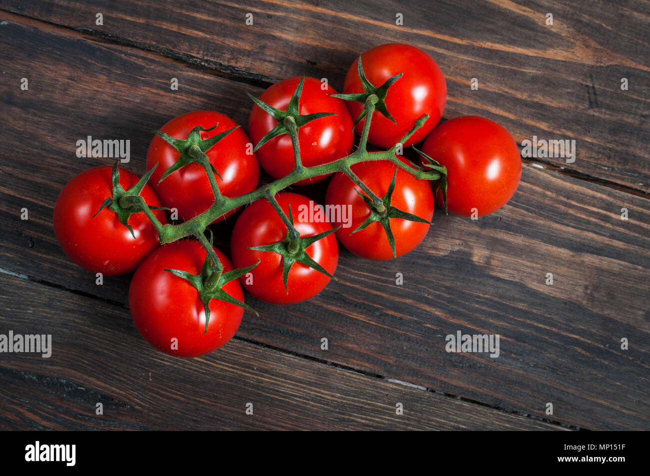 Fresh cherry tomatoes on wood background. Organic food Stock Photo - Alamy