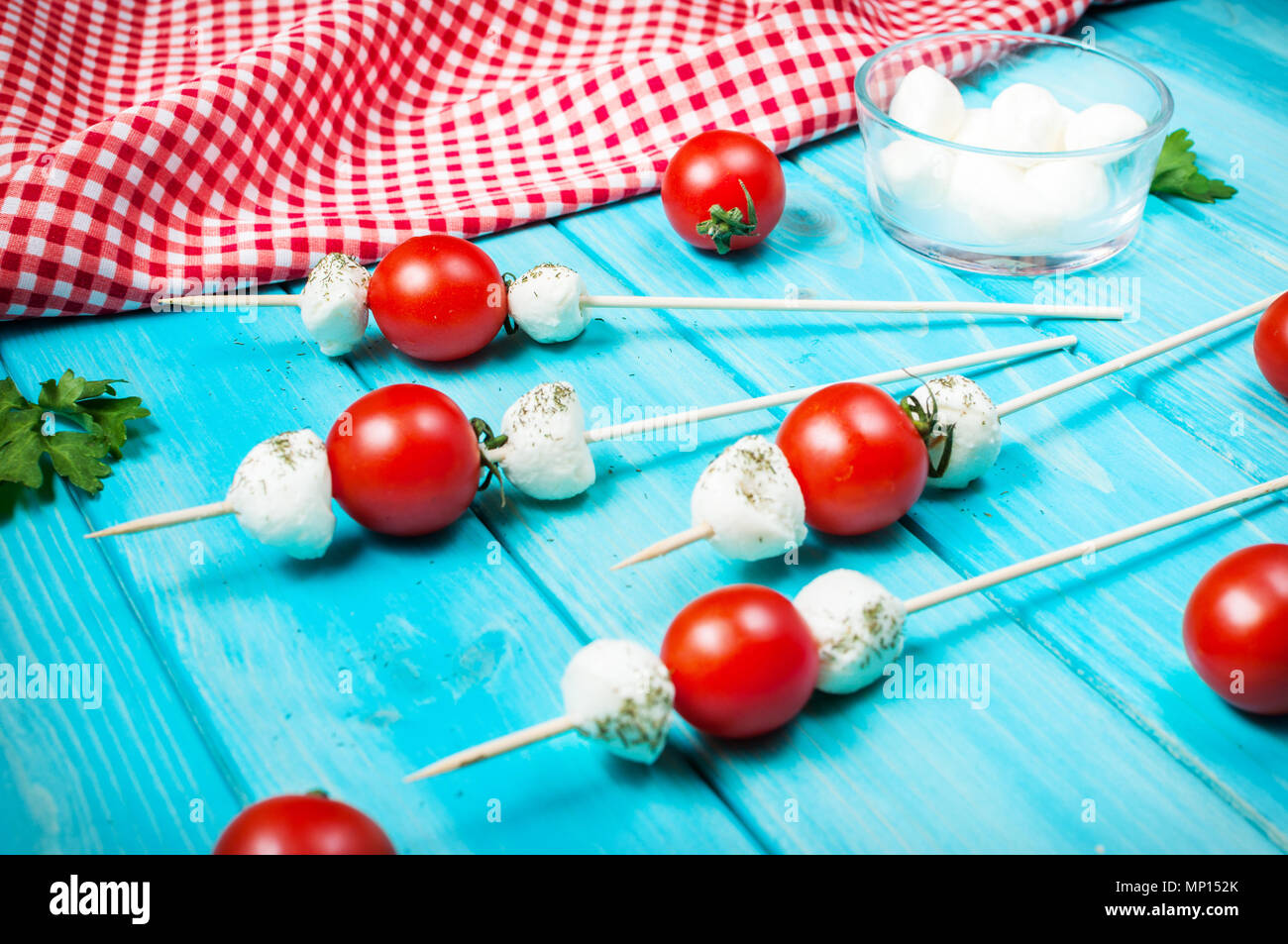 Cherry tomatoes with mozzarella on a stick Stock Photo Alamy