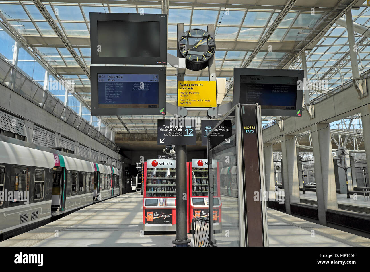 Selecta machines RER B line station platform French train waiting to depart from Charles de