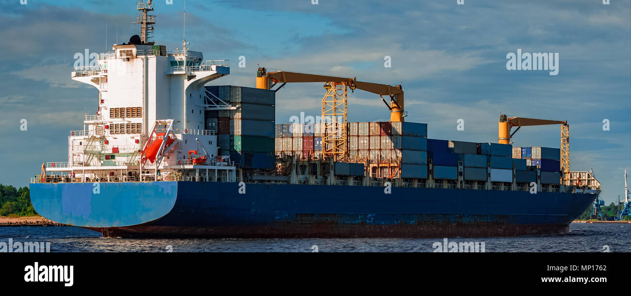 Blue container ship. World logistics and production transfer Stock