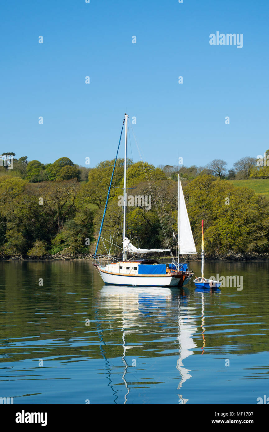 yacht moored in a creek off the helford river, cornwall, england, britain, uk. Stock Photo