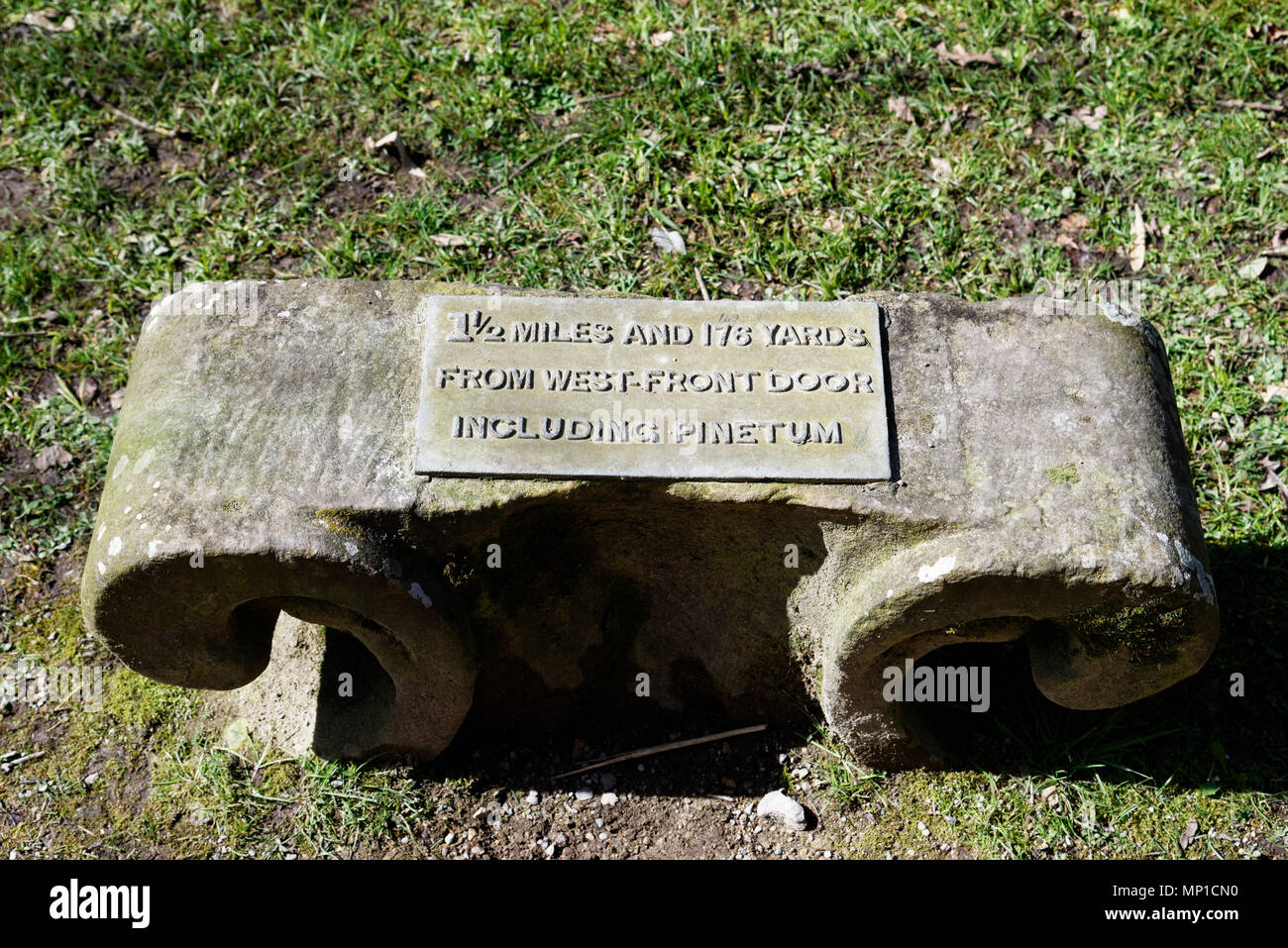 A milestone in the grounds of Chatsworth House saying 1.5 miles from west front door Stock Photo