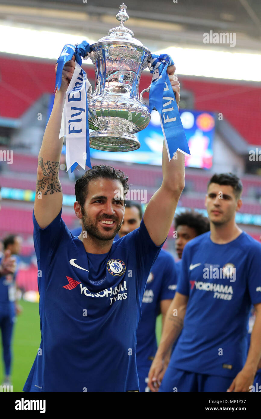 London, UK. 19th May 2018. Cesc Fabregas of Chelsea holds the FA Cup trophy  after the match.The Emirates FA Cup final 2018, Chelsea v Manchester United  at Wembley Stadium in London on