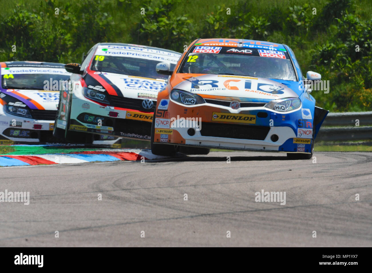 Andover, Hampshire, UK. 20th May, 2018. Tom Boardman (AmD with AutoAid/RCIB Insurance Racing) racing at Thruxton Race Circuit during the Dunlop MSA British Touring Car Championship at Thruxton Race Circuit, Andover, Hampshire, United Kingdom. Cars behind are Bobby Thompson (Team HARD/Trade Price Cars) and Michael Caine (Team HARD/Trade Price Cars). With the highest average speed of any track visited by the BTCC, Thruxton's 2.4 mile circuit provides some of the biggest thrills and spills in motor sport and has earned a reputation of being a true driver's track. Stock Photo