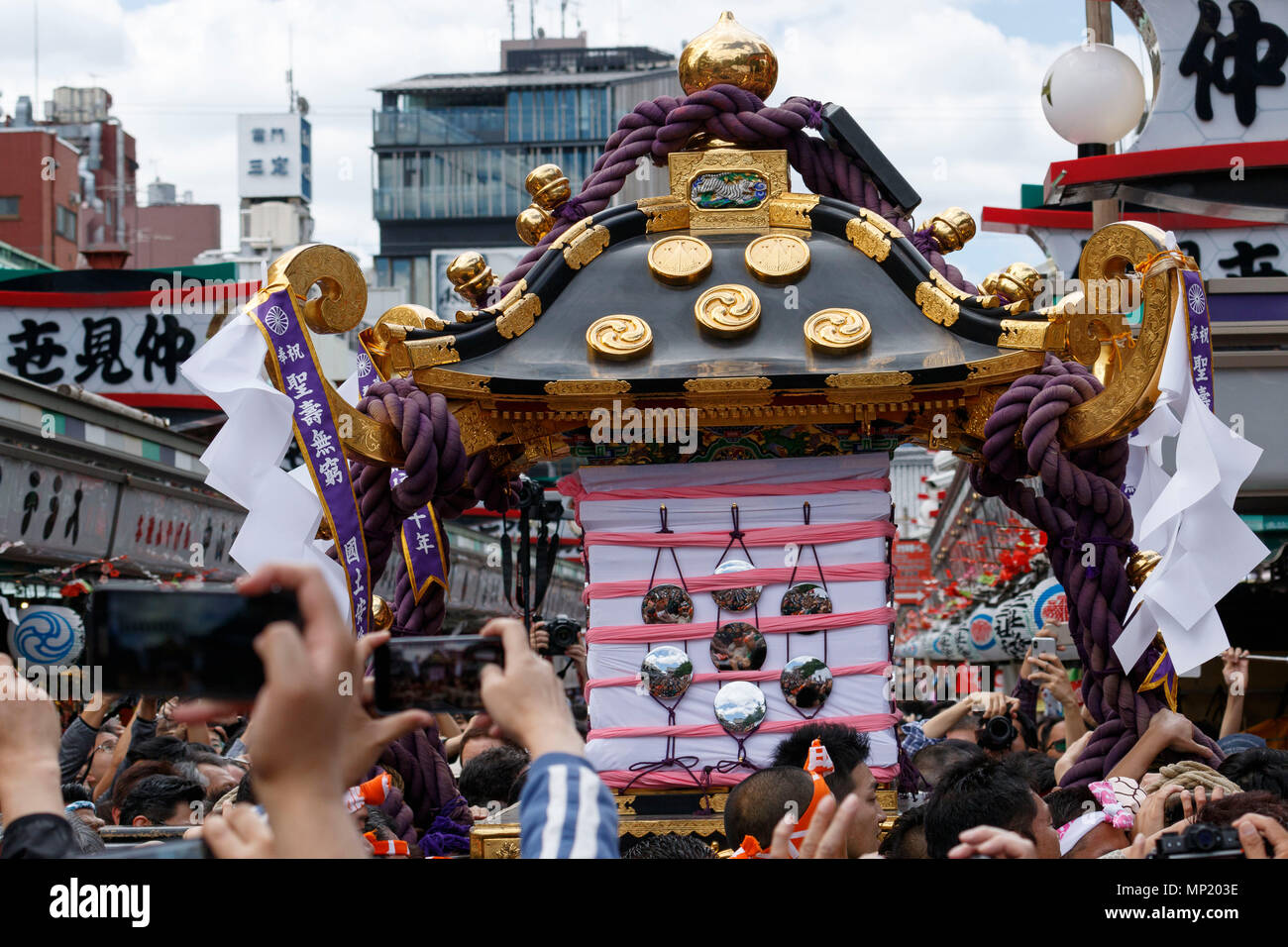 Participants carry a Mikoshi (portable shrine) during the Sanja Matsuri in  Asakusa district on May 20, 2018, Tokyo, Japan. The Sanja Matsuri is one of  the largest Shinto festivals in Tokyo, and
