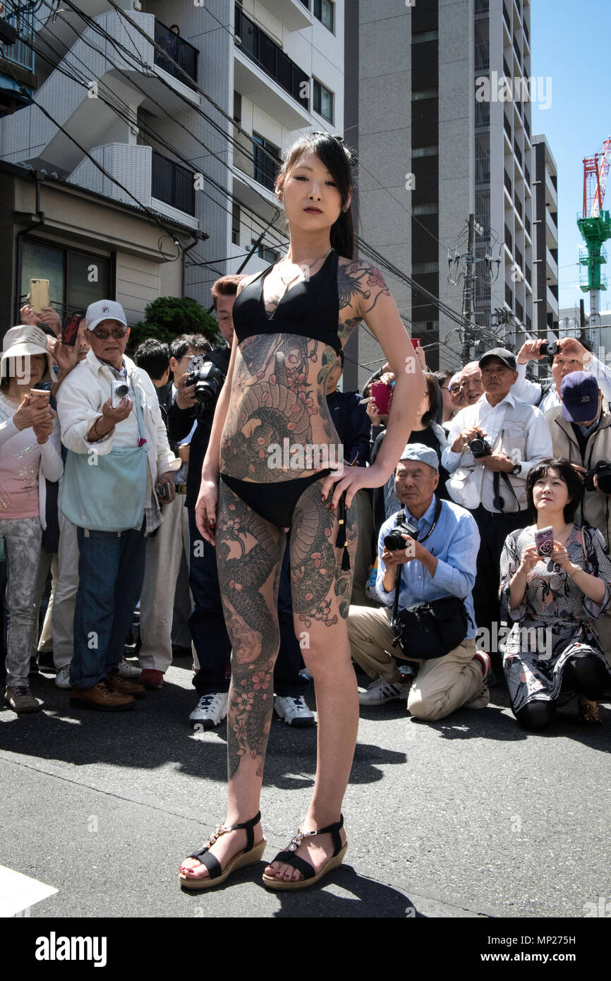 TOKYO, JAPAN - MAY 20: A heavily tattooed Japanese woman pose for photo during Tokyo's one of the largest three day festival called 'Sanja Matsuri' on the third and final day, May 20, 2018 in Tokyo, Japan. A boisterous traditional mikoshi (portable shrine) is carried in the streets of Asakusa to bring luck, blessings and prosperity to the area and its inhabitants. (Photo: Richard Atrero de Guzman/ Aflo) Stock Photo