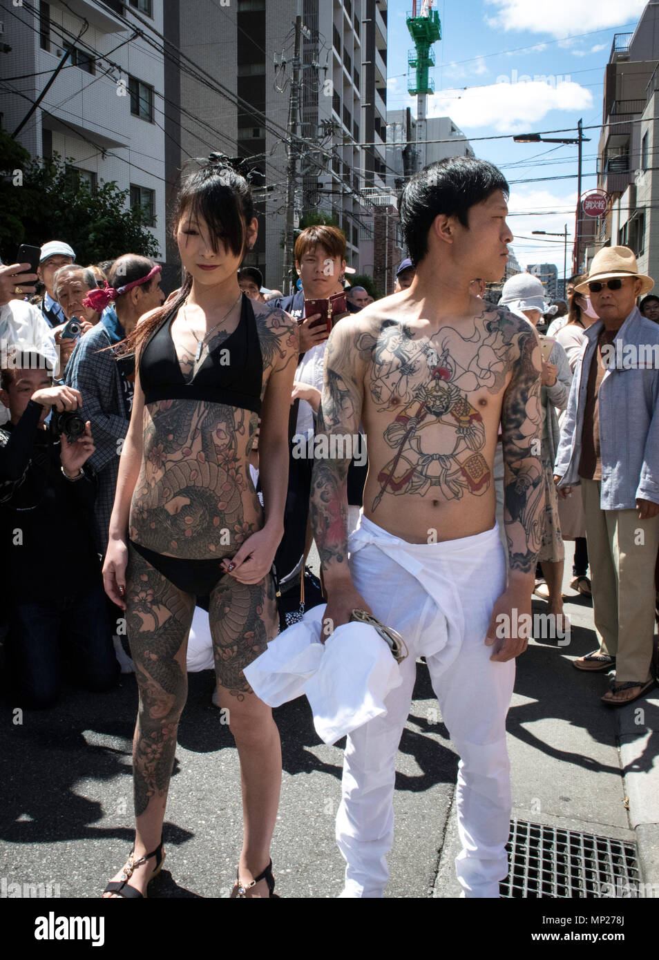 TOKYO, JAPAN - MAY 20: Heavily tattooed Japanese man and woman pose for photo during Tokyo's one of the largest three day festival called 'Sanja Matsuri' on the third and final day, May 20, 2018 in Tokyo, Japan. A boisterous traditional mikoshi (portable shrine) is carried in the streets of Asakusa to bring luck, blessings and prosperity to the area and its inhabitants. (Photo: Richard Atrero de Guzman/ Aflo) Stock Photo