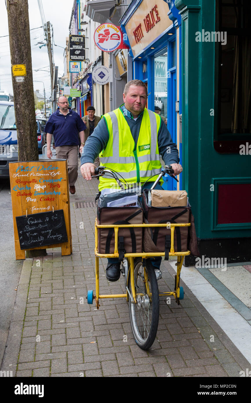 Irish Post Office, An Post, Postman with letter and parcel carrying ...