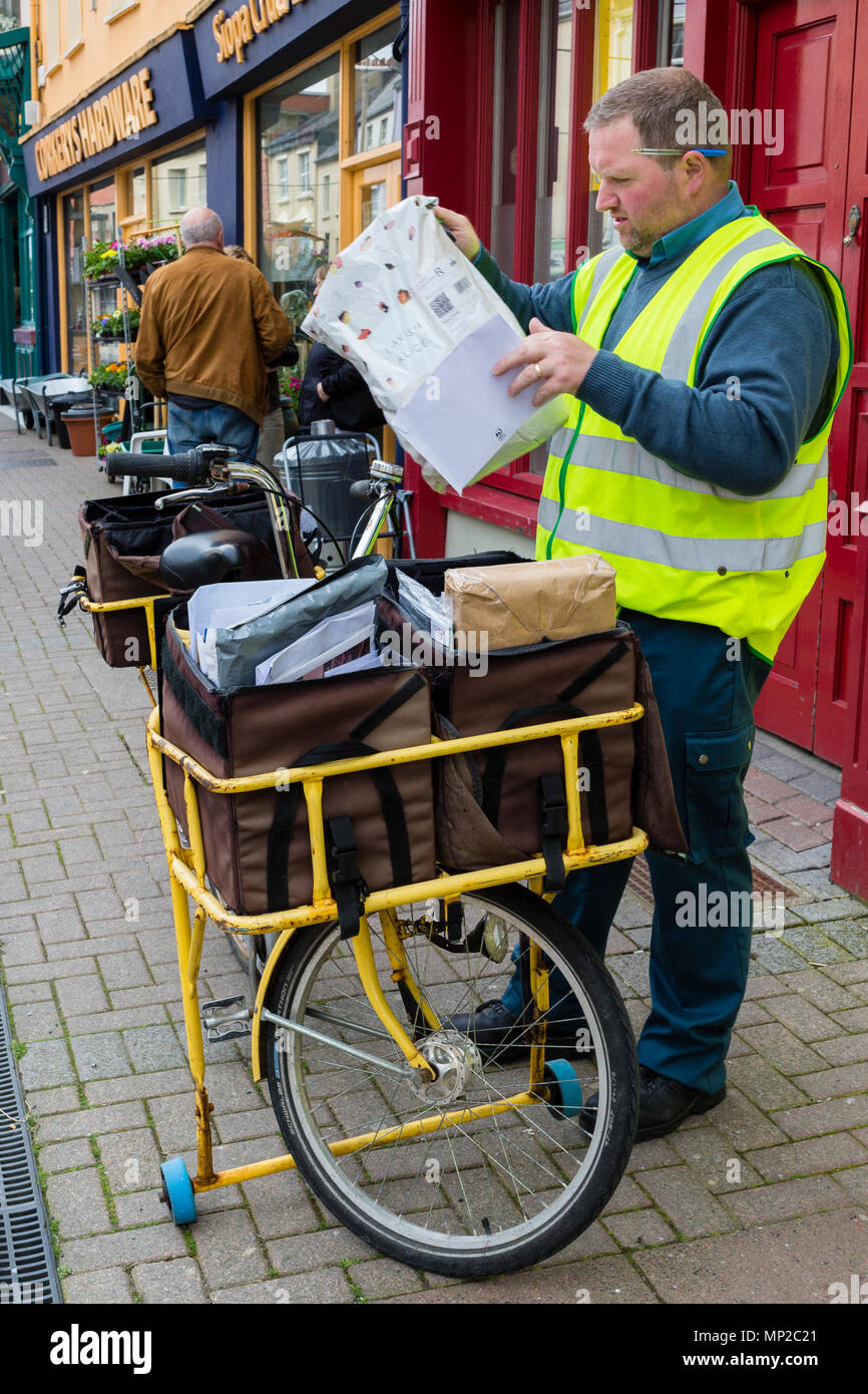 Irish Post Office, An Post, Postman with letter and parcel carrying ...