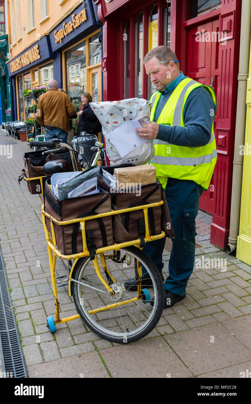 Irish Post Office, An Post, Postman with letter and parcel carrying ...
