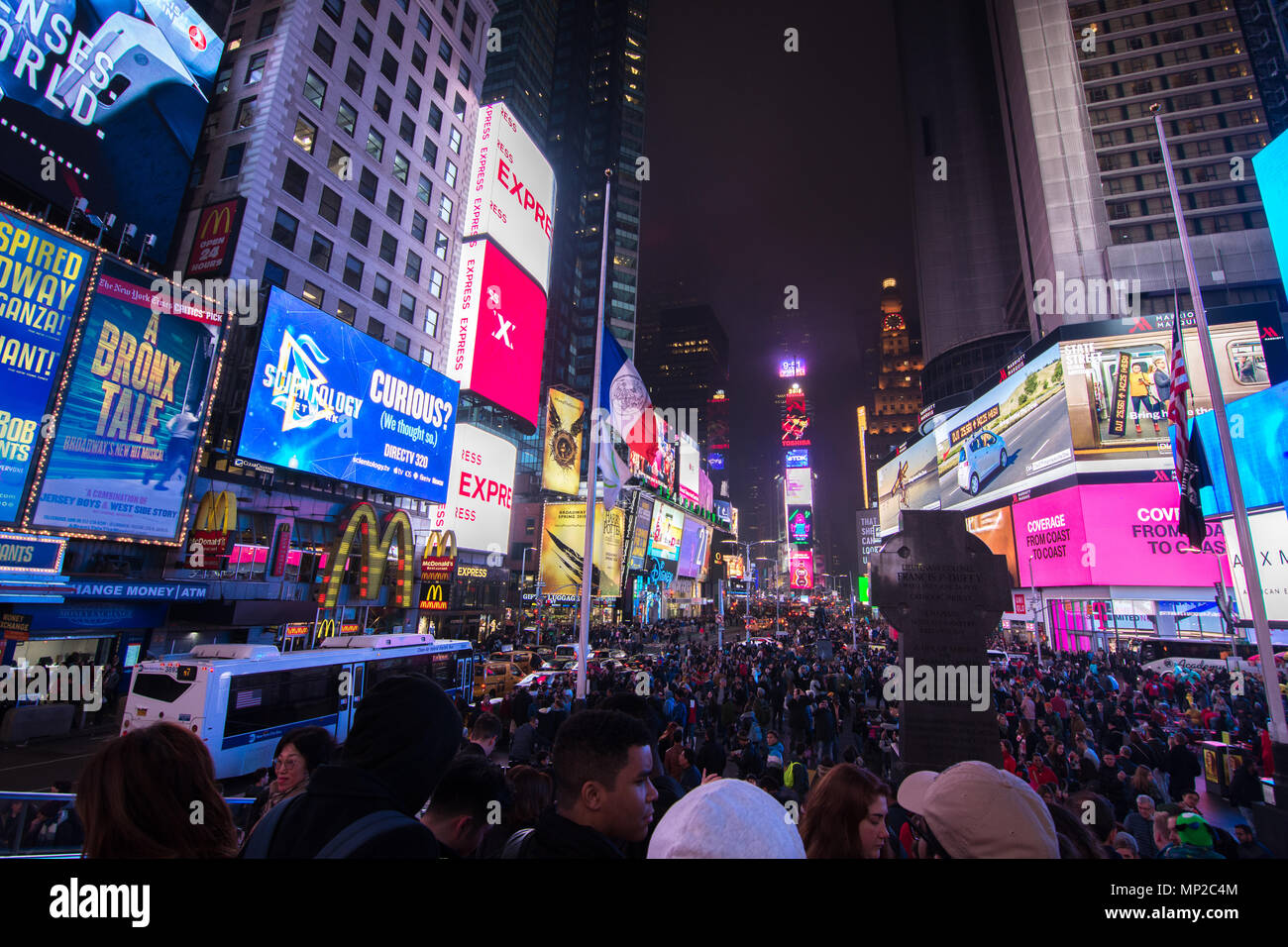 New York, US - March 30, 2018: View of people visiting the famous Times Square in New York on a foggy night Stock Photo