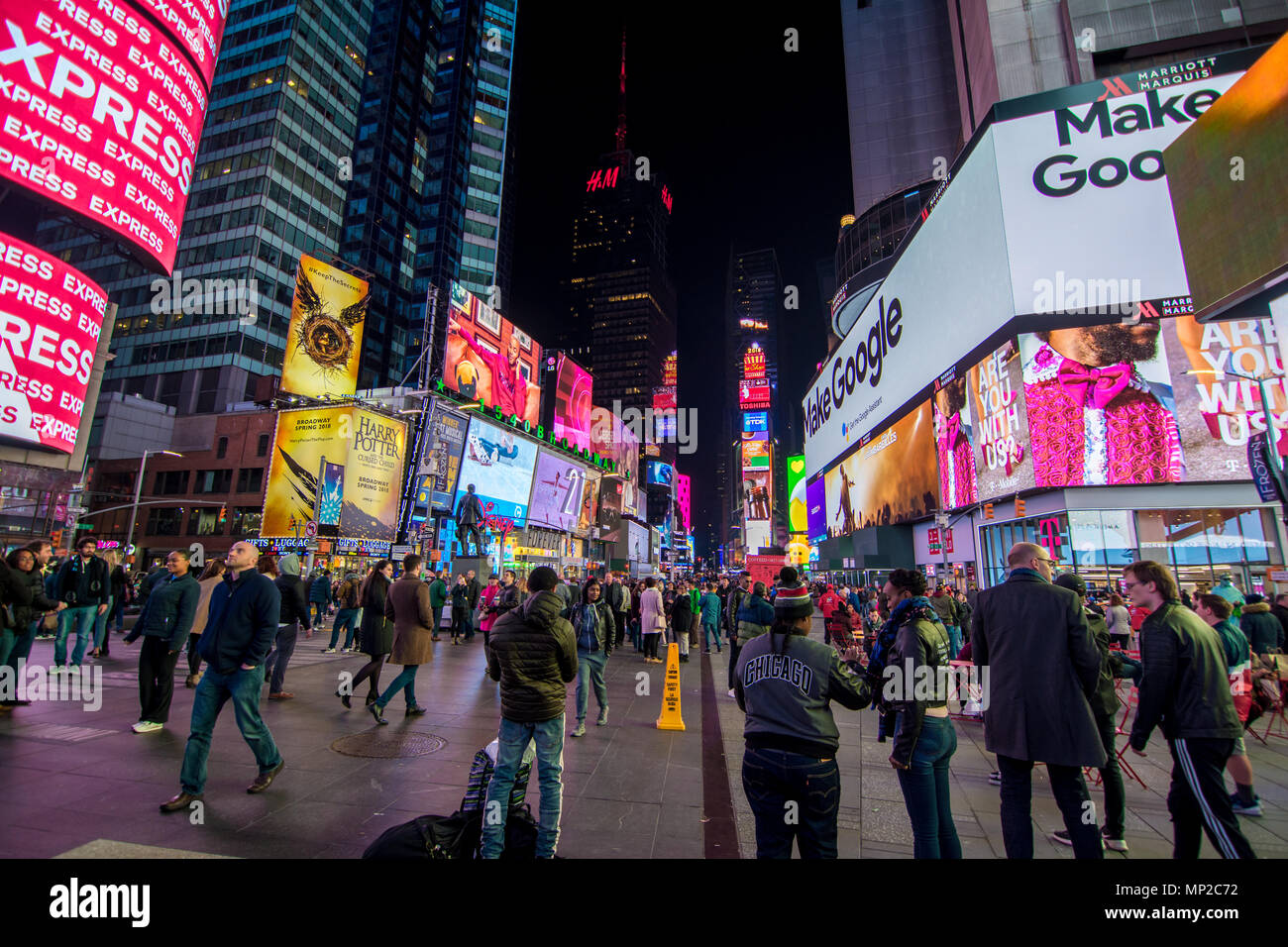 New York, US - March 30, 2018: View of people visiting the famous Times Square in New York at night Stock Photo