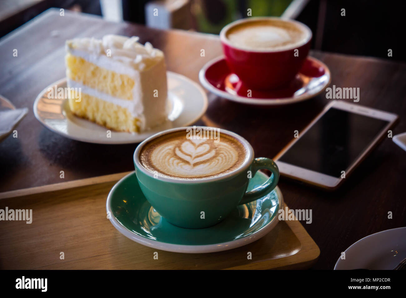 coffee time in the wood table cafe , drink and tasty cake Stock Photo - Alamy