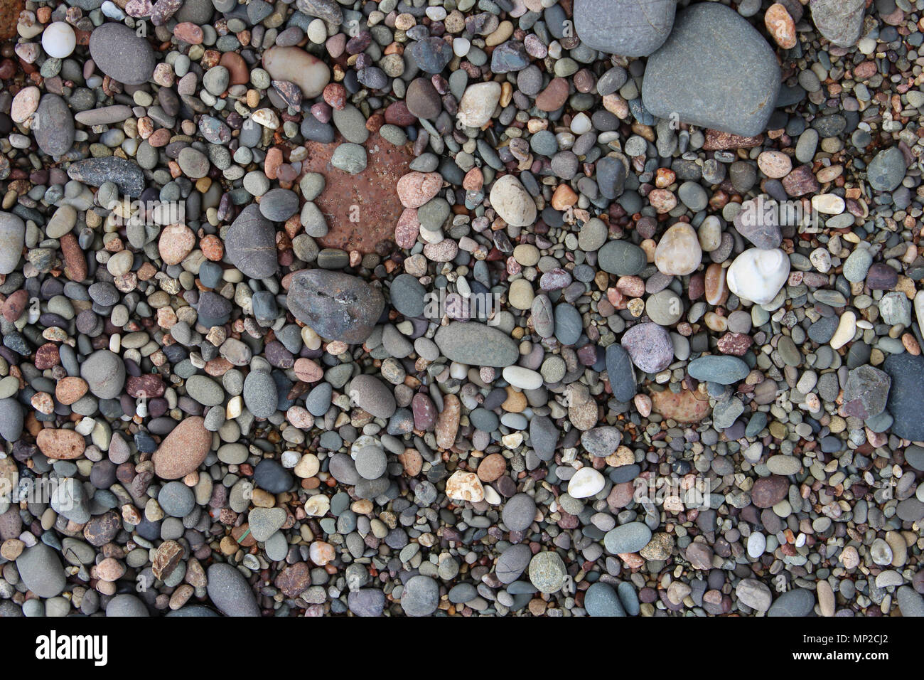 Pebbles on a Beach, Background Image of Pebbles Stock Photo
