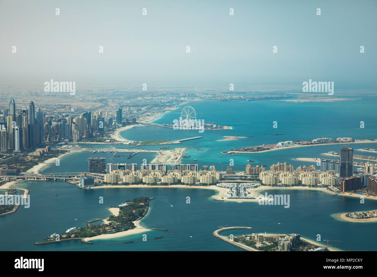 Dubai Eye and Marina district behind Palm Jumeirah man made island