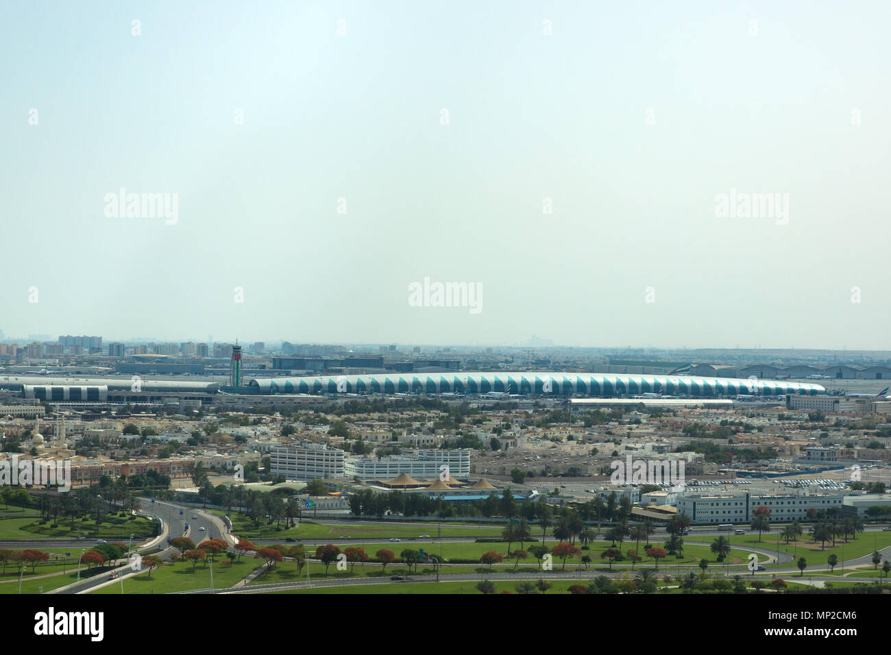 Aerial view of Dubai DXB airport terminal on a clear sunny day. Dubai, UAE. Stock Photo