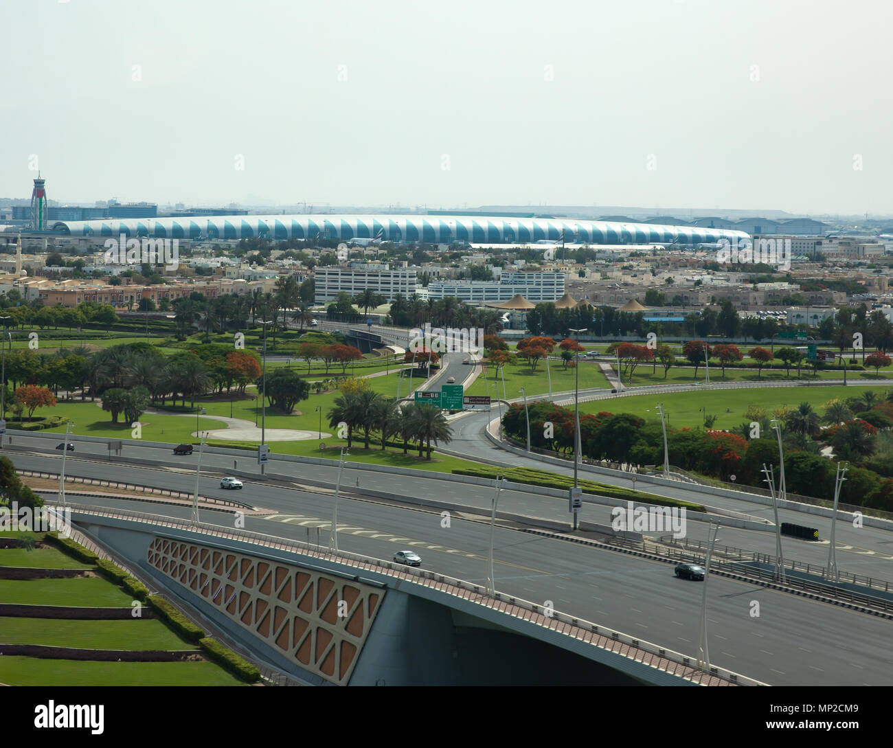 Aerial view of Dubai DXB airport terminal on a clear sunny day. Dubai, UAE. Stock Photo