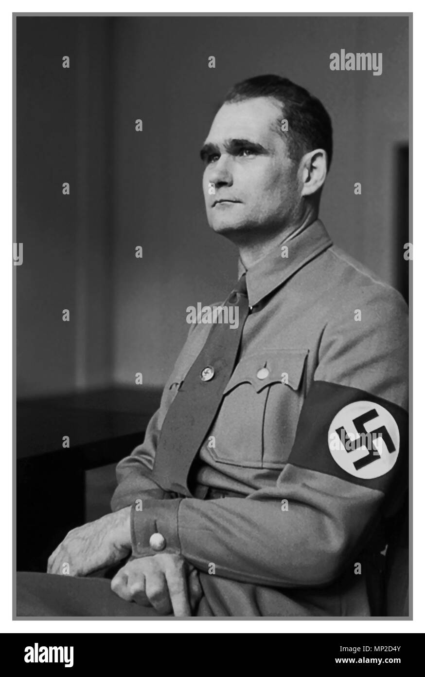 1930's Vintage historic formal portrait of Rudolf Hess wearing a Nazi Swastika Armband. Hess was a prominent politician in Nazi Germany. Appointed Deputy Führer to Adolf Hitler in 1933, he served in this position until 1941, when he flew solo to Scotland in an attempt to negotiate peace with the United Kingdom during World War II. He was taken prisoner and eventually was convicted of crimes against peace, serving a life sentence in Spandau prison until his suicide Stock Photo