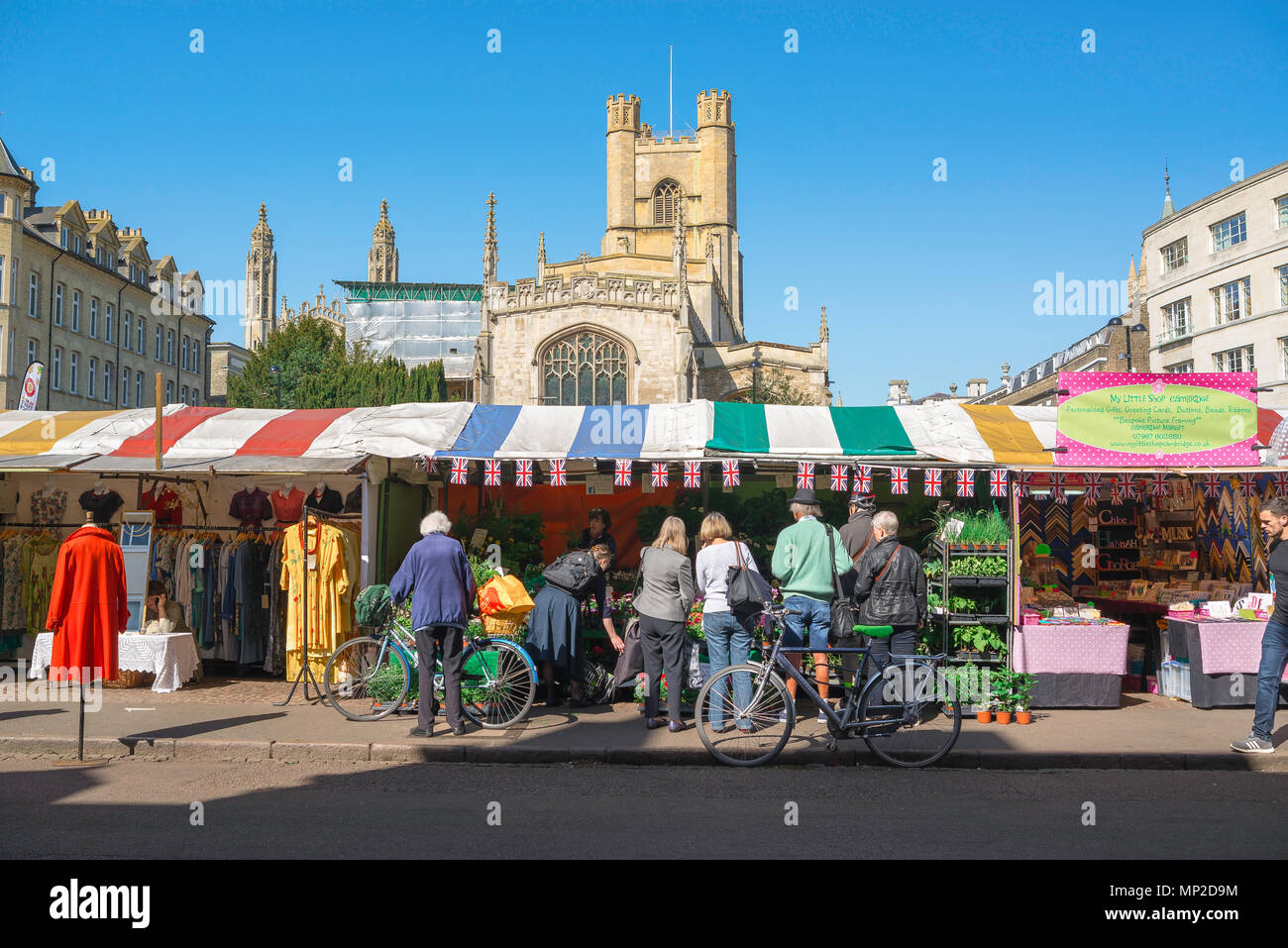 Cambridge city centre, view of people buying flowers from a plant stall in Market Hill in the centre of Cambridge, England, UK. Stock Photo