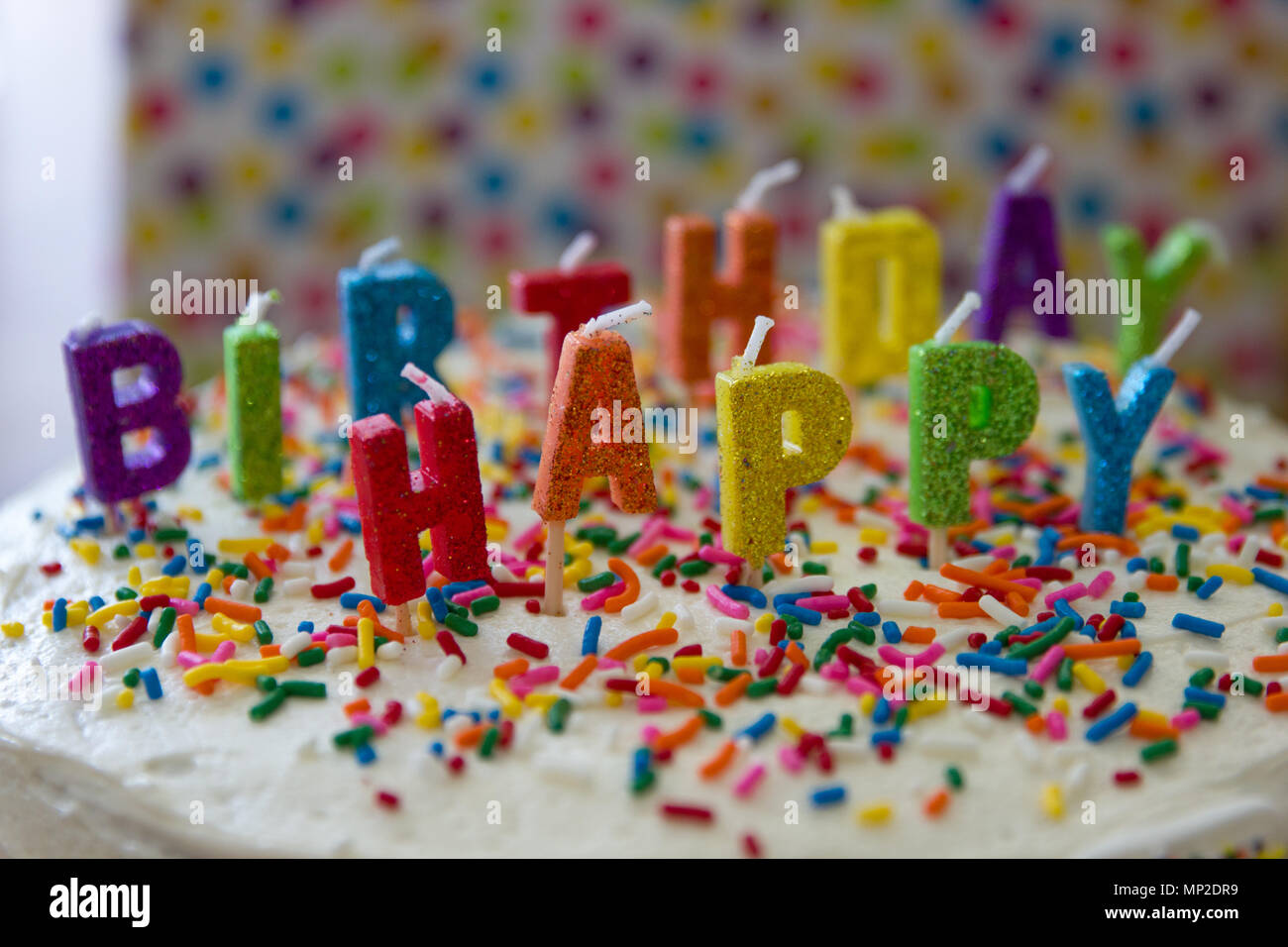 Bright colorful rainbow decorated gifts and cake for 15th birthday  celebration Stock Photo - Alamy
