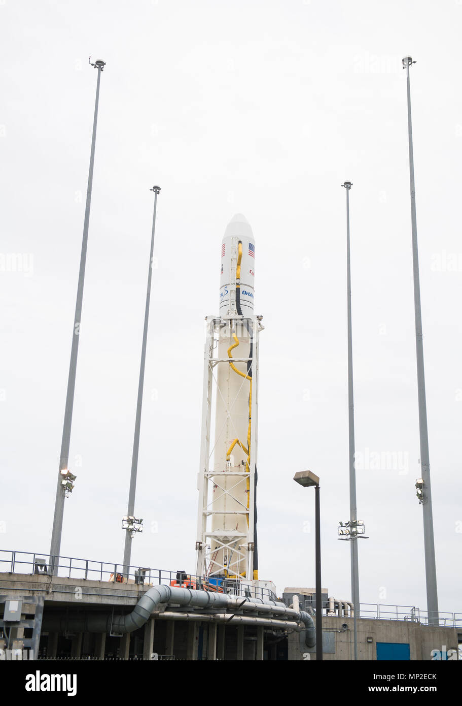 The Orbital ATK Antares rocket, with the Cygnus spacecraft onboard, is positioned on launch Pad-0A, early at Wallops Flight Facility May 19, 2018 in Wallops, Virginia. The Antares will carry the Cygnus spacecraft filled with 7,400 pounds of cargo for the International Space Station on May 21st. Stock Photo
