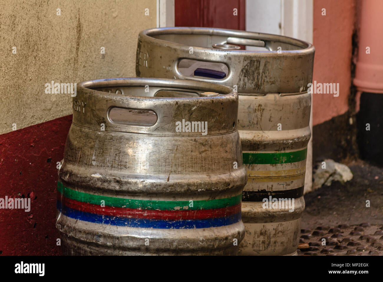 Metal beer cask and keg outside a pub, empty and waiting for collection by brewery. Teignmouth, Devon. Feb 2018. Stock Photo