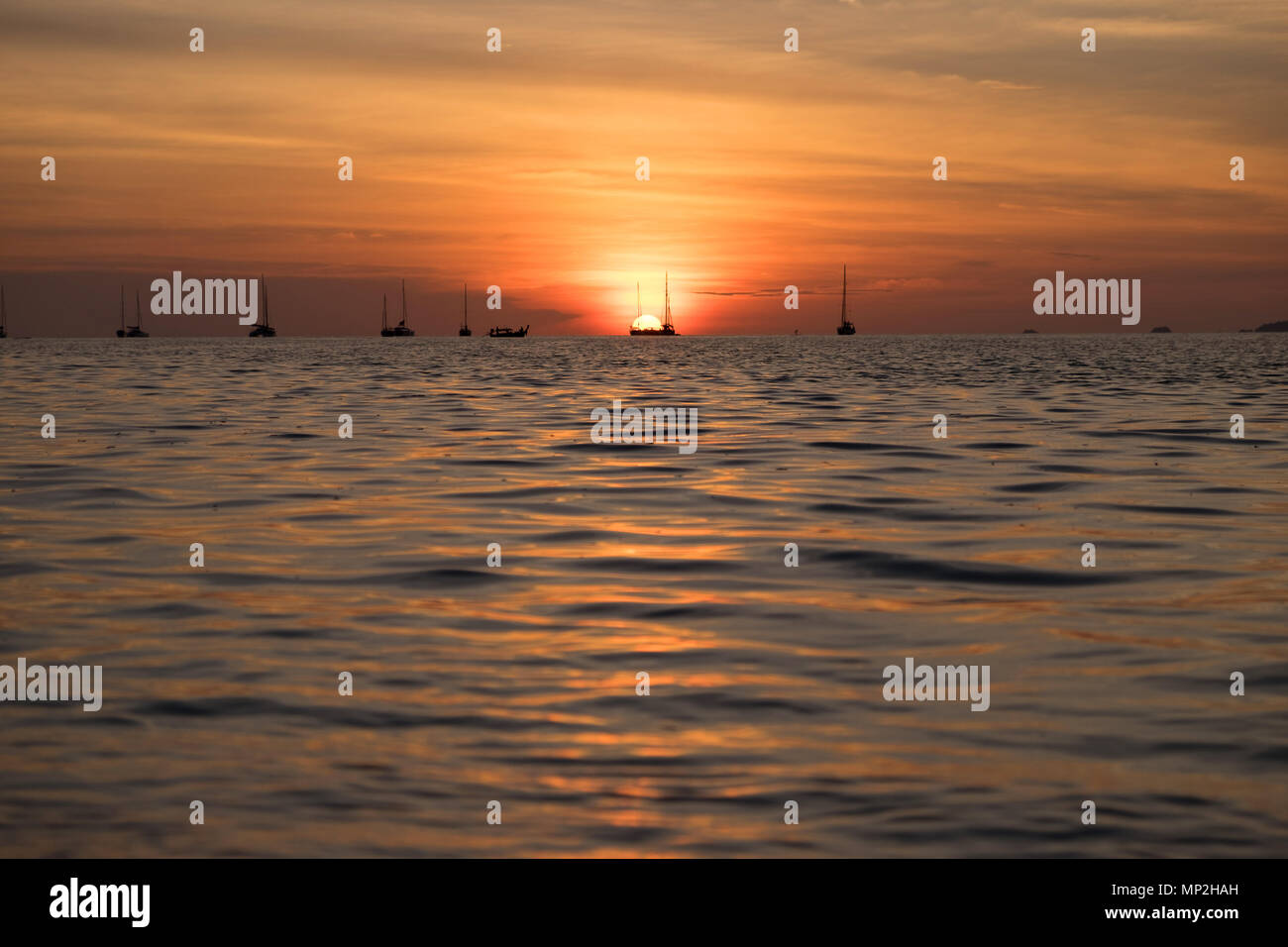 Beautiful sunset above the sea beach Stock Photo - Alamy