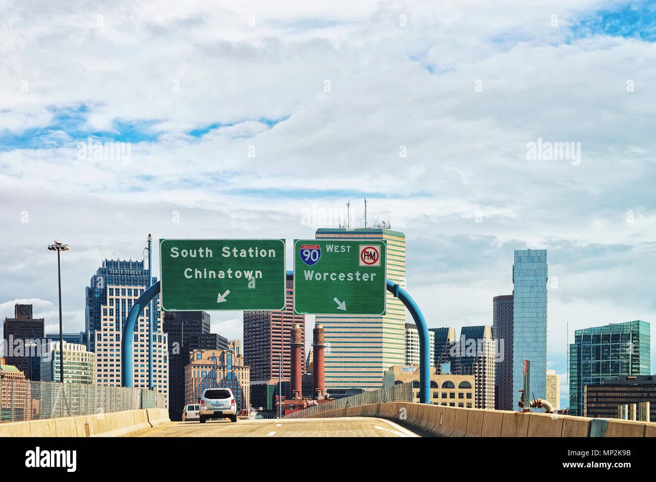 Boston, USA April 29, 2015 Cars in the road at Boston skyline, MA