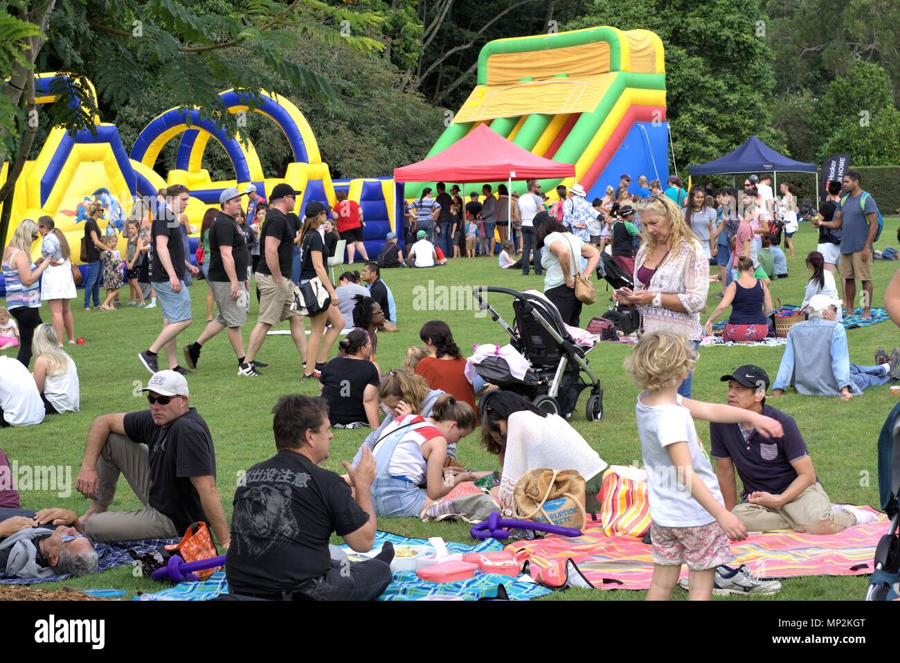 People in park in Australian city of Coffs Harbour's Botanic Garden. People of all ages enjoying day out at Japanese Children's Day Festival. Children Stock Photo